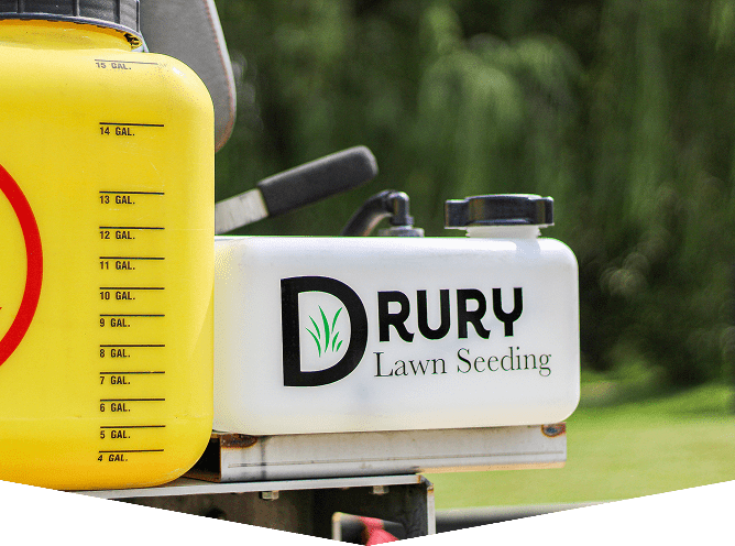 Lawn seeding equipment with company logo.