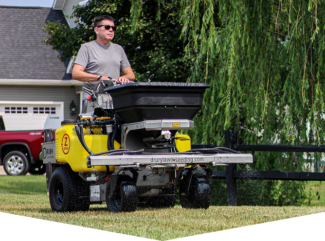 Man operating a yellow lawn machine outdoors.
